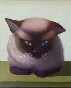 An oil painting of a Siamese cat sits facing the viewer with it paws folded on a green table top. Beyond there is a grey wall background.