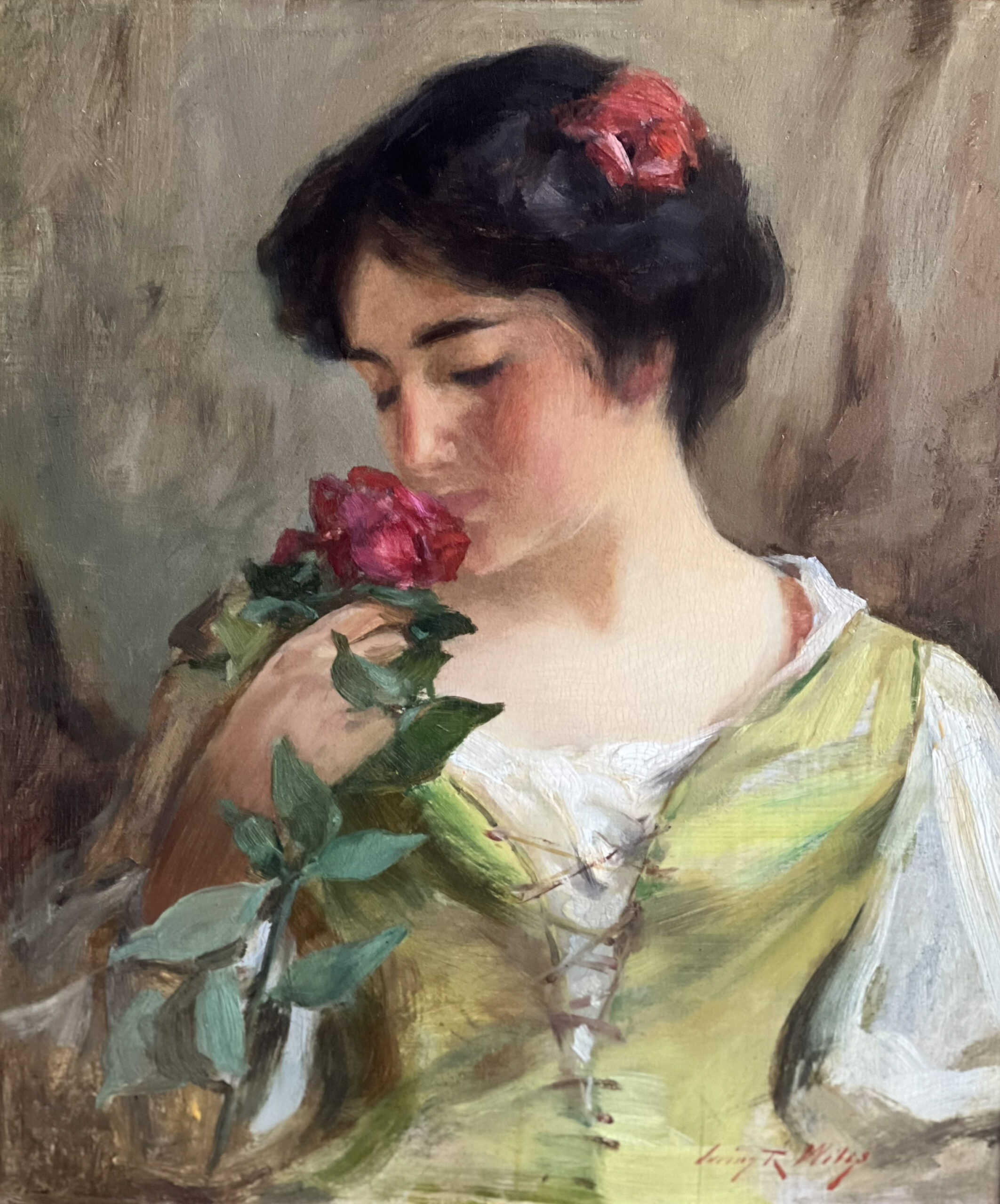 Visit Wiles - A young lady with short dark hair in a white blouse under a green laced corset smells a red rose. There is another red rose in her hair.